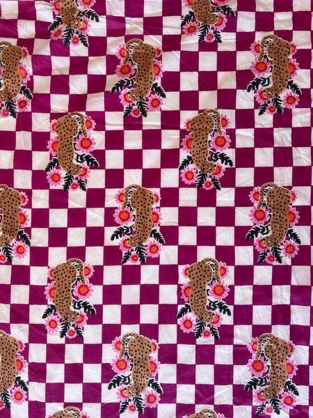 cotton fabric |  leopards with flowers on plum and white checks