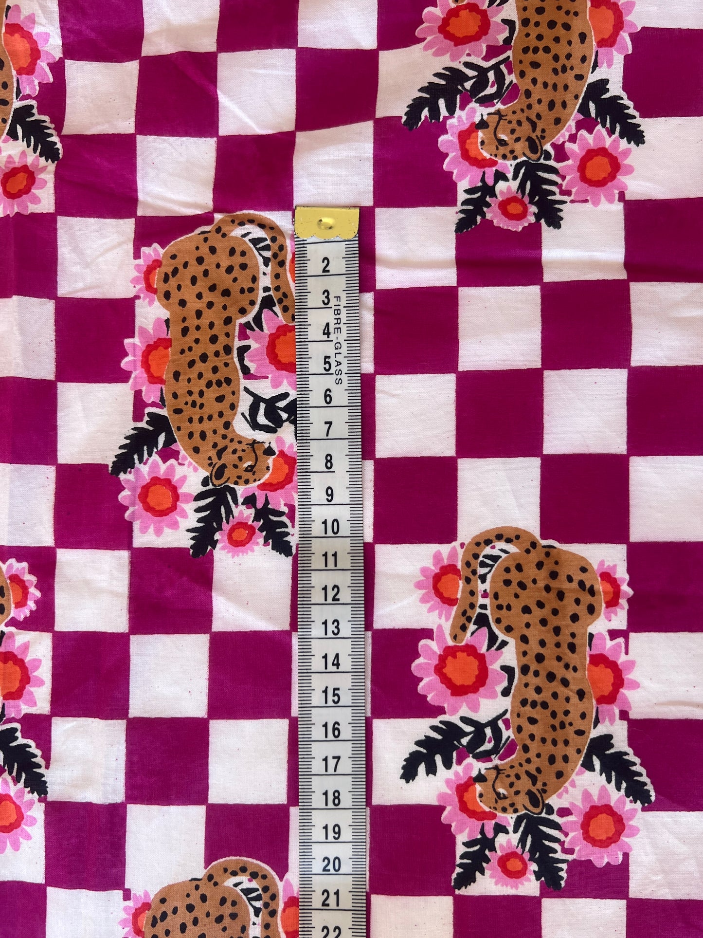 cotton fabric |  leopards with flowers on plum and white checks