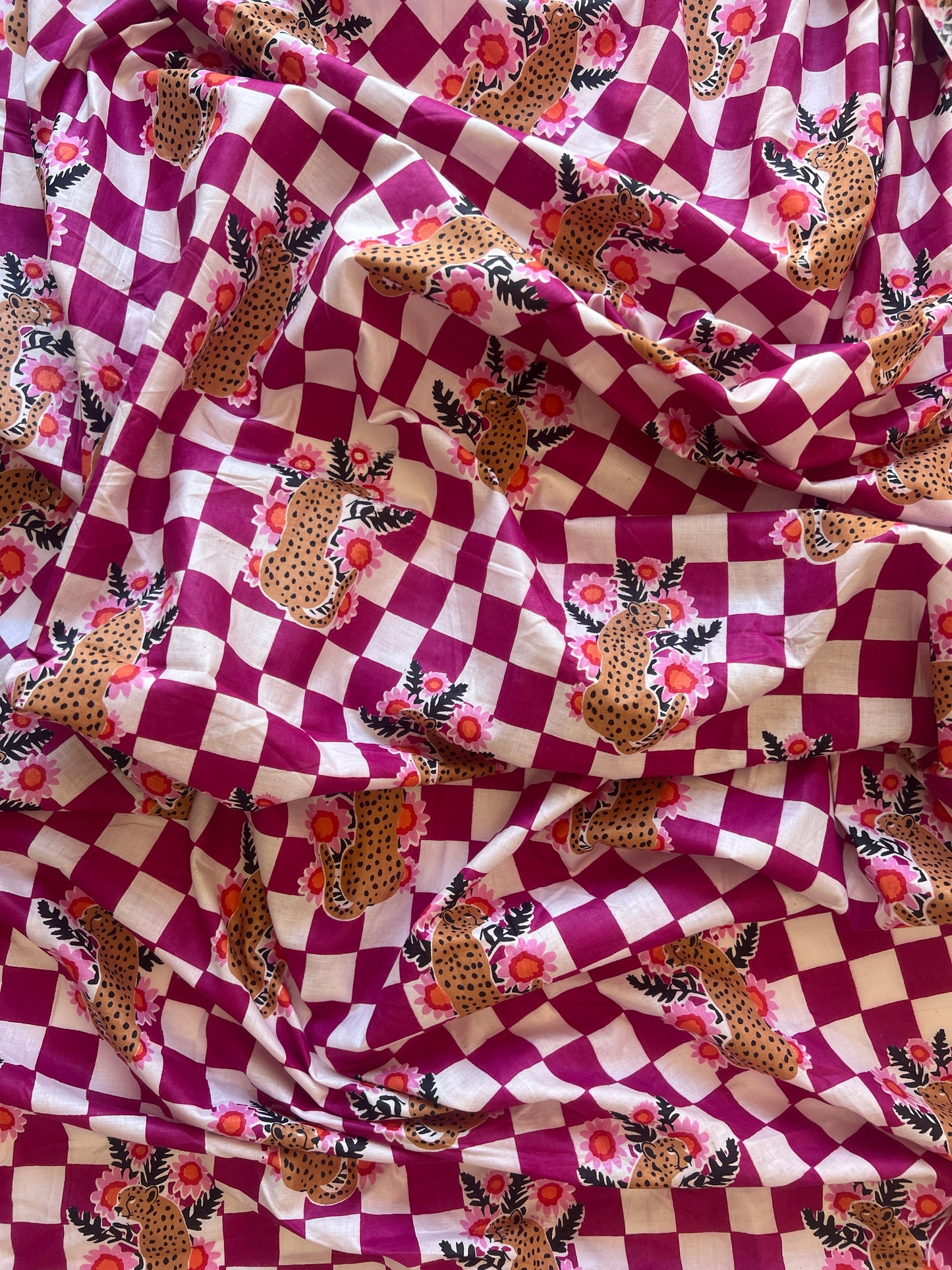 cotton fabric |  leopards with flowers on plum and white checks