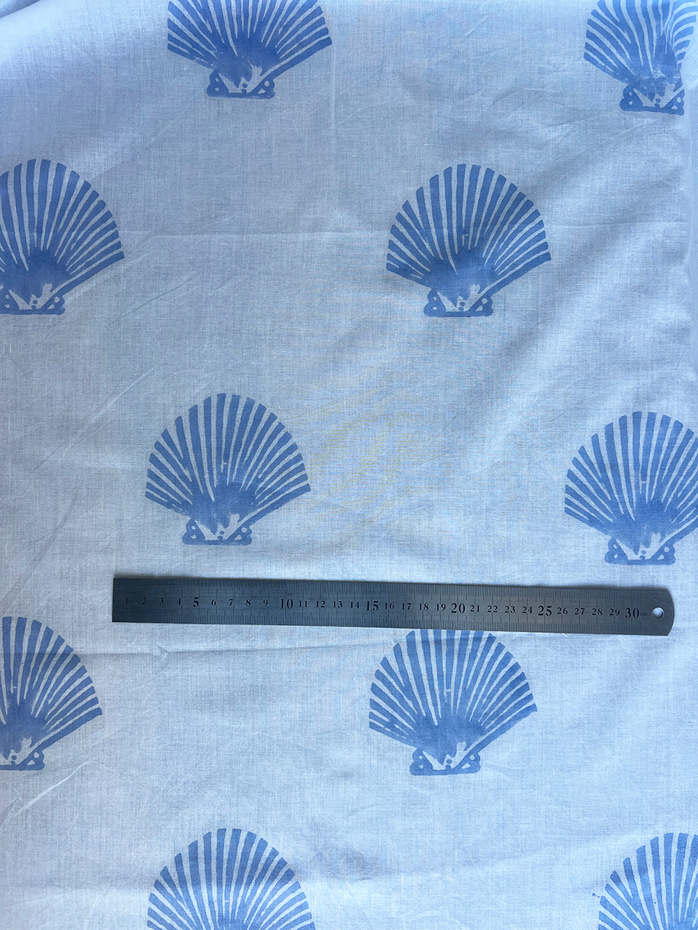 cotton fabric |  pale blue shells on white
